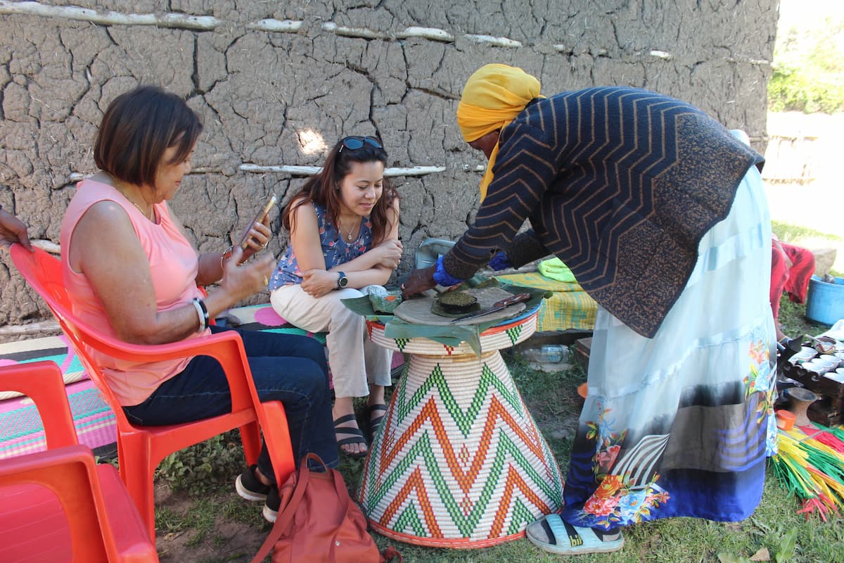 Tasting Kotcho bread at Tiya, Ethiopia